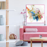 Modern living room with a pink sofa, coffee table, and abstract art on the wall.
